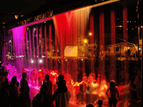 Digital water curtain by Dhyani Technologies displaying programmable water patterns and text effects using synchronized water droplets and LED lighting.