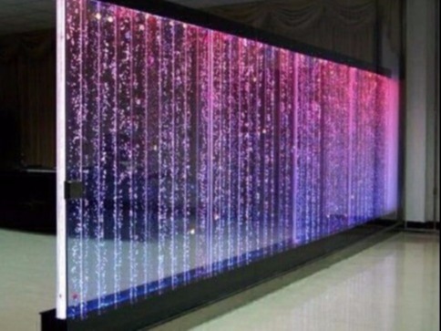 Modern indoor fountain and bubble wall fountain designed by Dhyani Technologies with flowing water effects, LED lighting, and elegant interior integration.