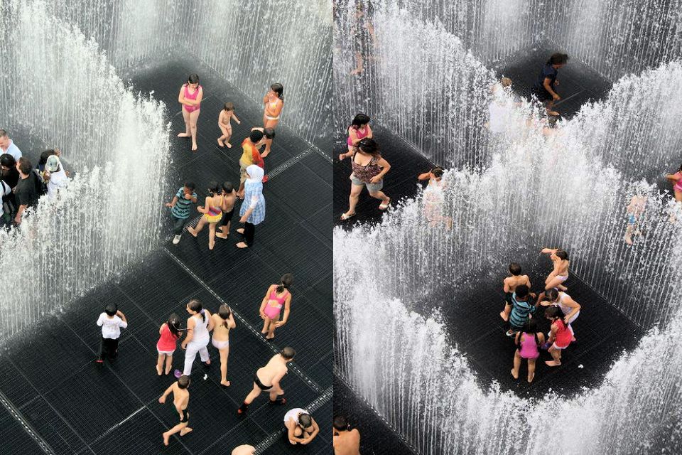 people walking through floor fountain jets