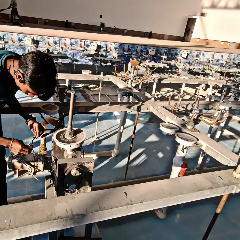 Technicians performing maintenance and restoration work on a musical fountain system
