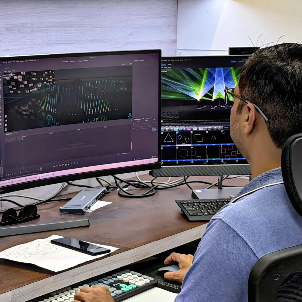 Musical fountain show with synchronized water jets, colorful lights, and laser effects controlled by advanced software