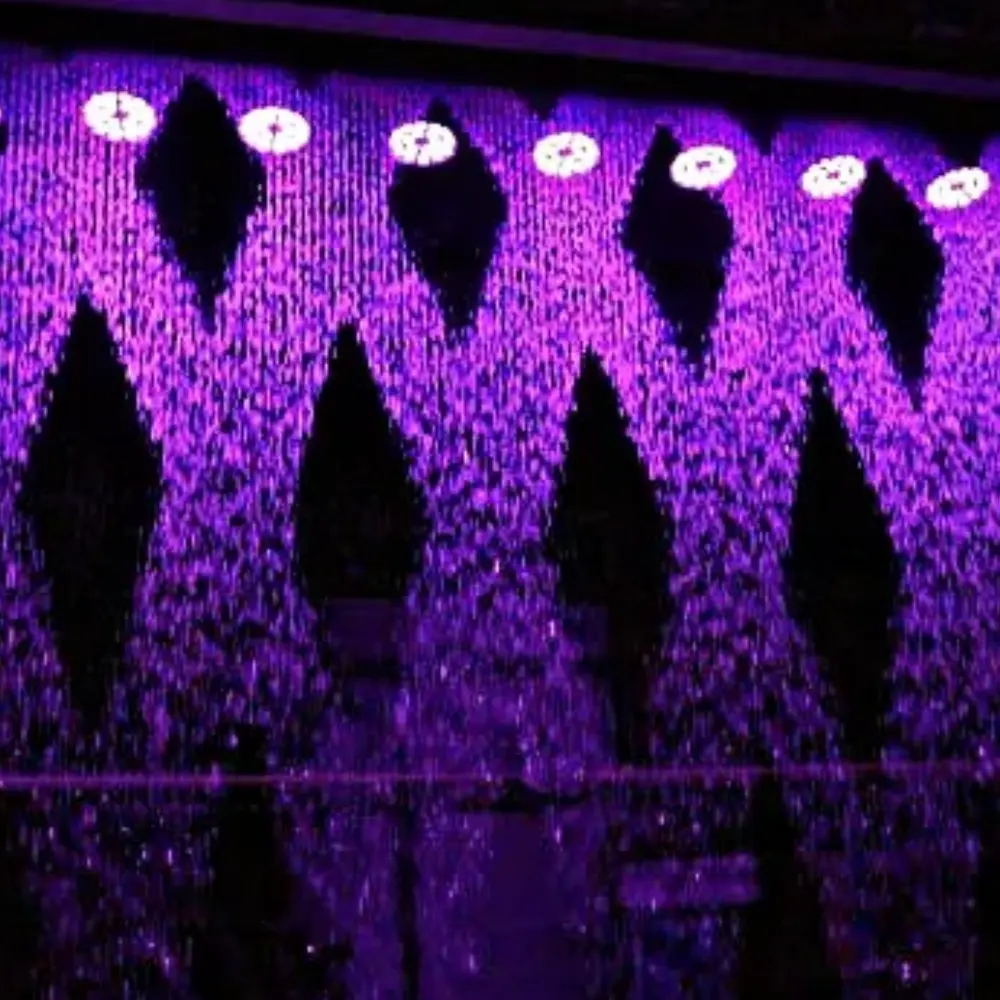 Digital water curtain displaying text and patterns using controlled falling water streams